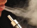 Smoking an e-cigarette.